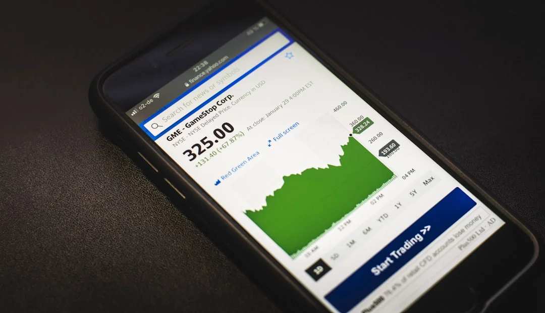 who-we-are Top-down view of an e-commerce chart on a table, with a smartphone, calculator, and magnifying glass.